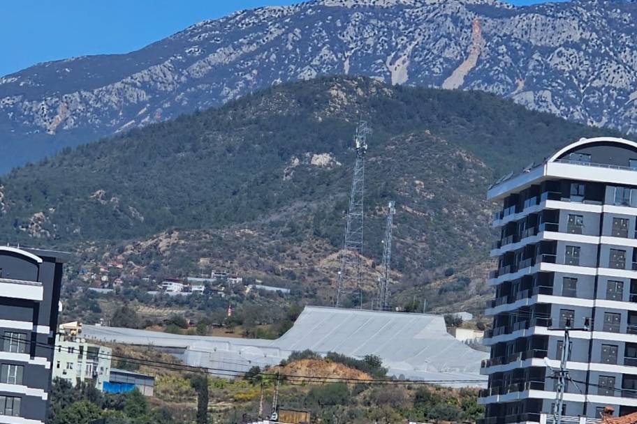 Аланияның өркендеген Демирташ ауданындағы теңіз көріністі жаңа пәтерлер мен дуплекстер