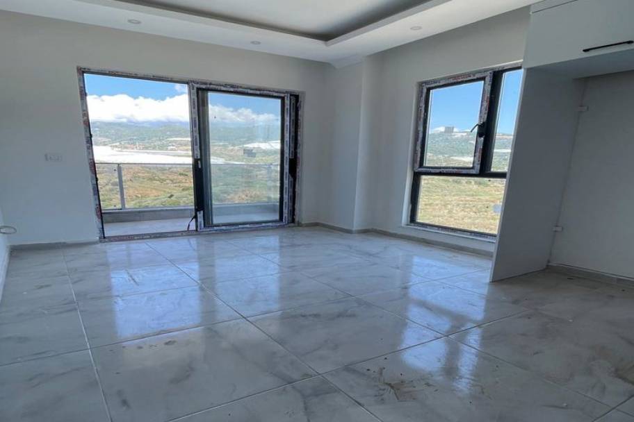 Аланияның өркендеген Демирташ ауданындағы теңіз көріністі жаңа пәтерлер мен дуплекстер