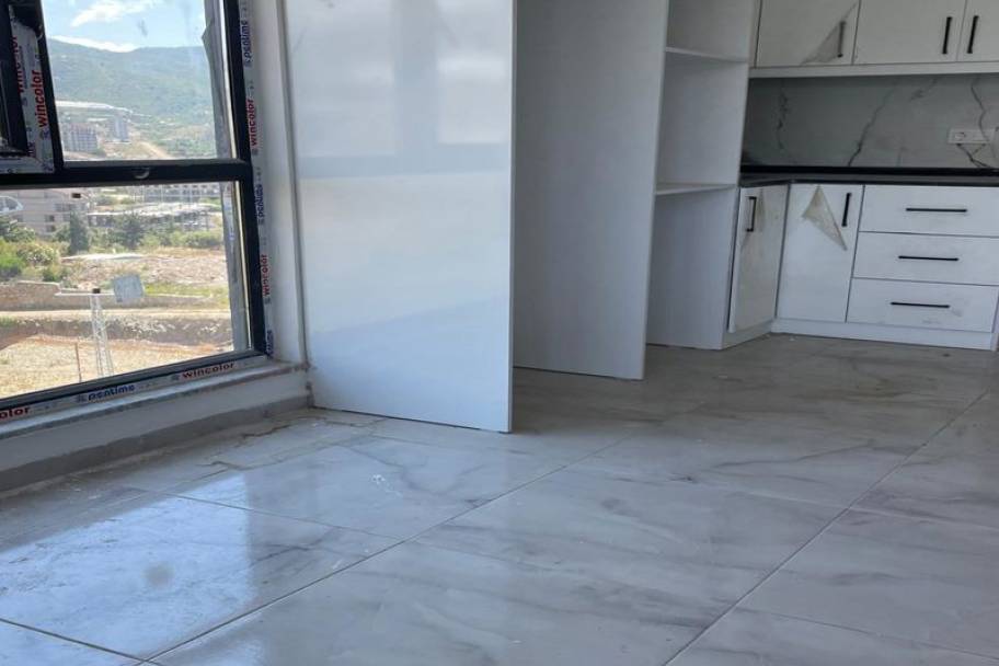 Аланияның өркендеген Демирташ ауданындағы теңіз көріністі жаңа пәтерлер мен дуплекстер